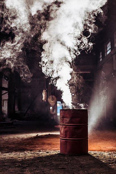 istock Burning barrel in old, abandoned factory 174769352