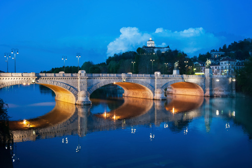 Evening view of an italian bridge from the Po river
