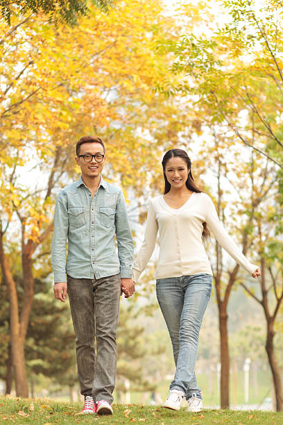 istock Beautiful smiling couple walking in the park. 174771382