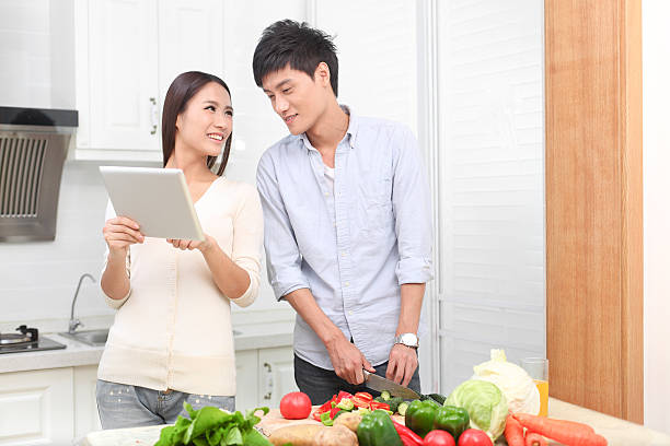 istock Cute couple preparing salad together 174771390