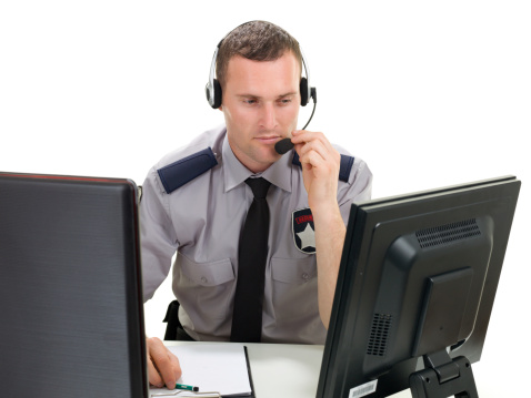 Security guard working in security call center.
