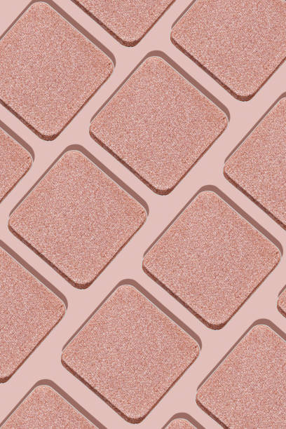 istock Minimal pattern eye shadow glitter pink swatches with shadow, monochrome photo as background, refill compact eyeshadow, shiny colored powder fo makeup, square shape metal pack, cosmetic texture 1747722252