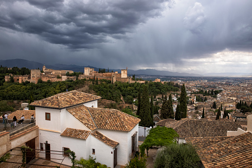 Aerial view of the Alhambra and central Granada in a stormy afternoon, Spain