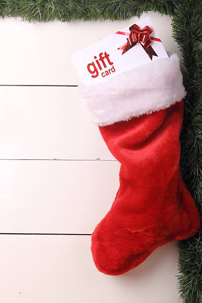 Christmas stocking with gift card inside stock photo