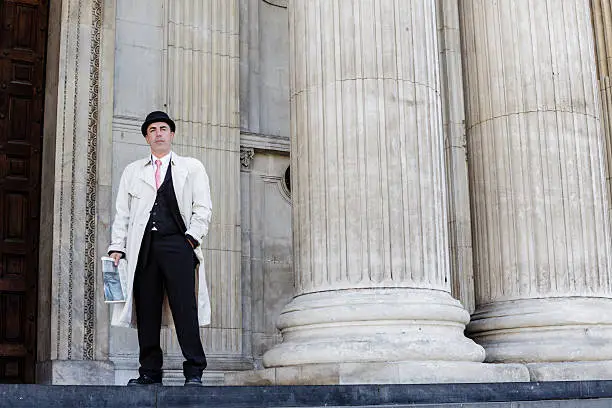 "Young stockbroker going out of Saint Paul's Cathedral in London, England"