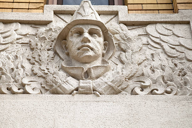 istock Fireman's head relief sculpture on a fire station in Montreal 174772927