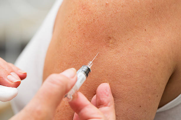 istock Flu vaccination...Nurse at work,vaccinating patient 174773070