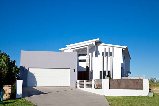 istock White and gray modern home with large gray garage  174773874