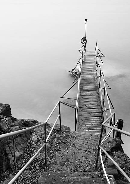 istock Old wooden boardwalk pier 174773894
