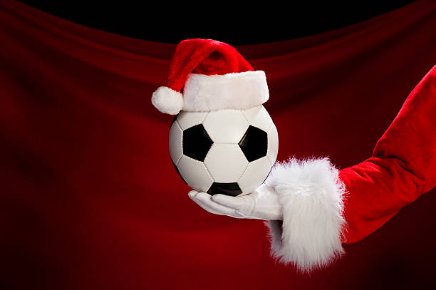 istock Santa Claus holding Soccer Ball 174774076