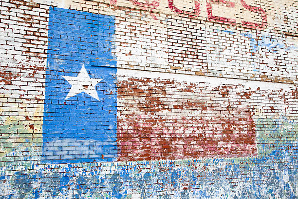 istock Texas flag painted on brick wall.  Old peeling paint, rustic, 174774179