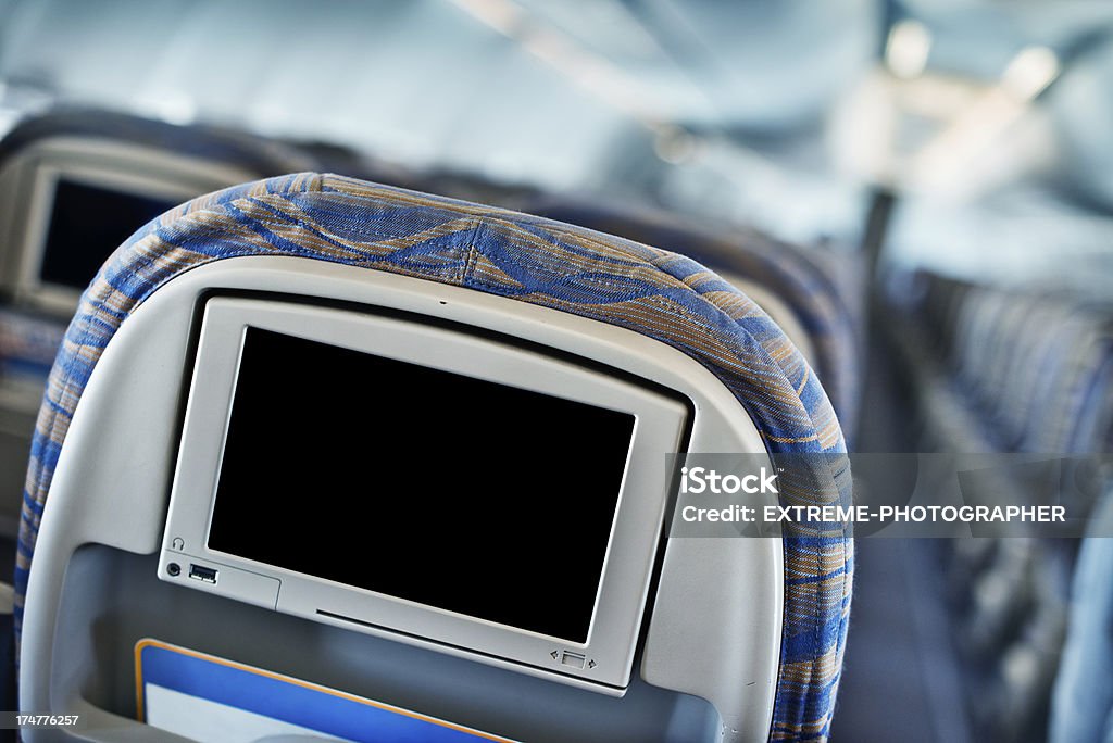 LCD screen Modern seat with LCD monitor in jet airplane. Aerospace Industry Stock Photo