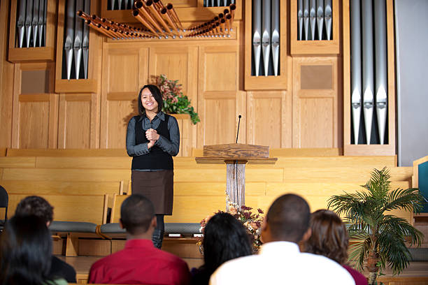 istock Young adults in church. 174776387