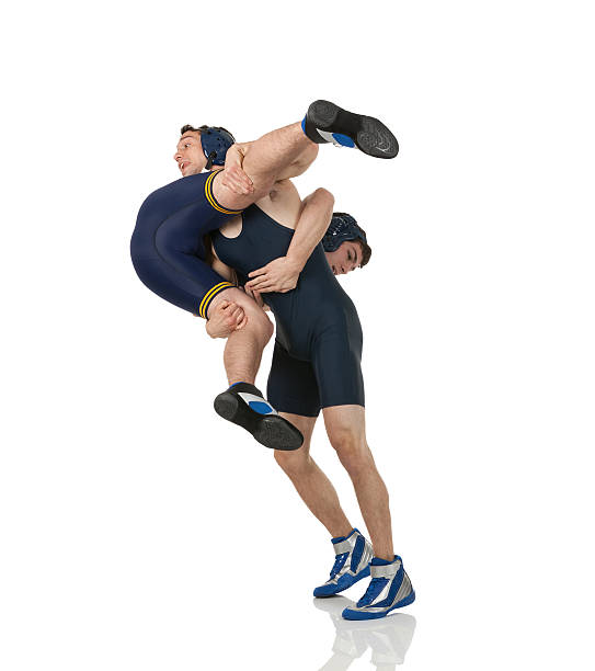 Two young men wrestling. Two young men wrestling.http://www.twodozendesign.info/i/1.png greco stock pictures, royalty-free photos & images