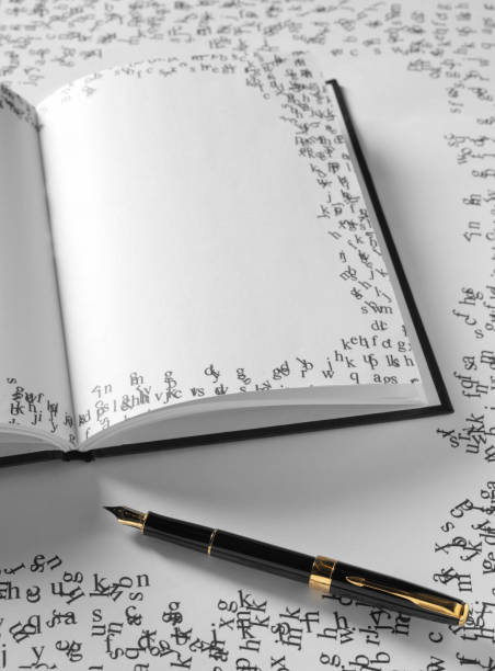 istock Ink Pen and Blank Page on a Open Book 174776791