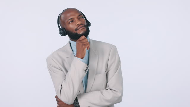 Call center, thinking and black man problem solving in studio isolated on a white background mockup space. Telemarketing idea, planning and sales consultant brainstorming business decision in doubt