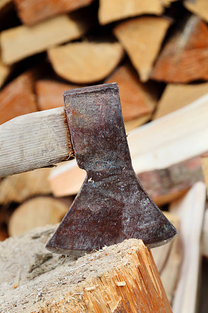 istock chopping wood axe on block in log woodpile 174777446