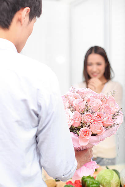 istock Man came home from work, sending flowers to woman. 174777532
