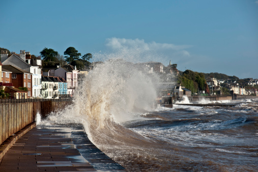 This was the highest tide of the year with southerly winds and low pressure so the tide was exceptionally high as can be seen from this wave which doesn't normally lift up onto the path and onto the railway line here at Dawlish a popular seaside town in south Devon