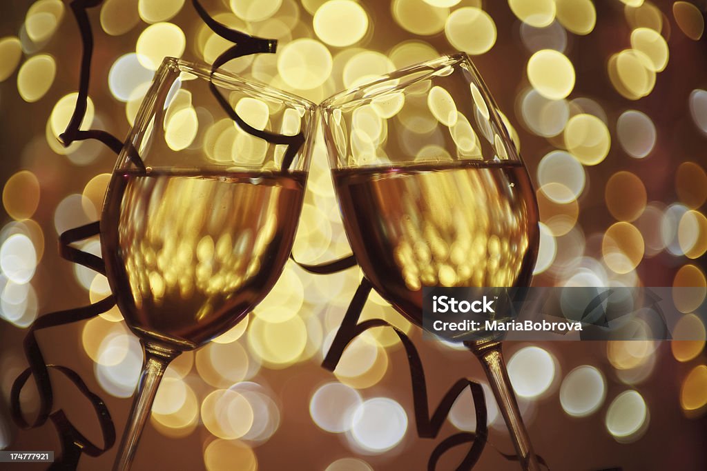 romantic dining Two wine glasses selective focus on abstract defocused light background, Pentax-M 50 1.7. Alcohol - Drink Stock Photo