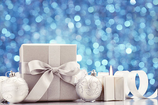 istock Silver christmas gift with decoration on blue 174778896