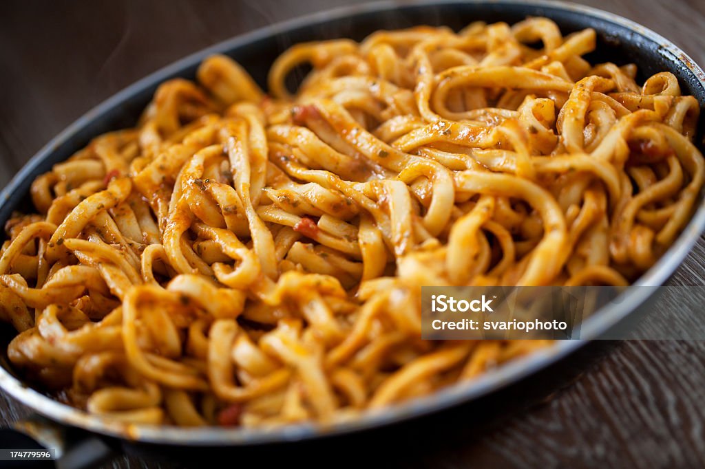 Tagliatelle with tomato sauce and pesto Pasta Stock Photo