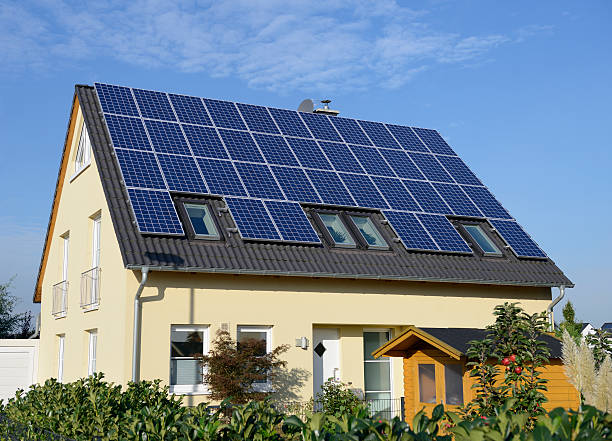 istock New yellow house with solar panels on the roof 174781094
