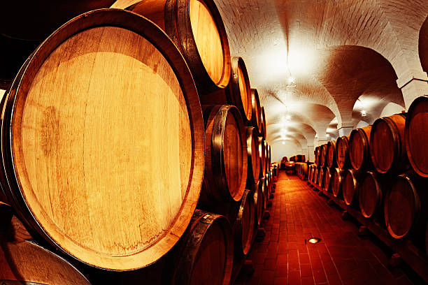 istock Winery cellar with many oak barrels of maturing wine 174781230