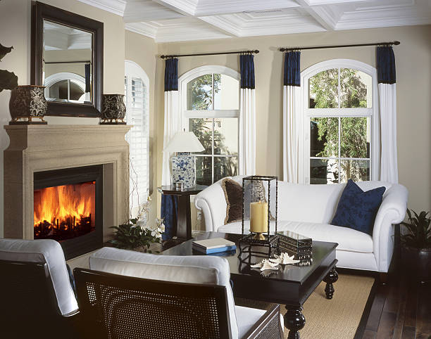 Beautiful appointed living room with spiral staircase in background.