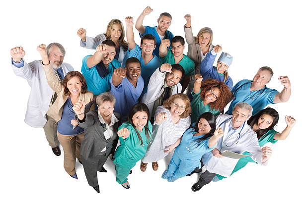 istock Large group medical team on white with arms raised 174781389