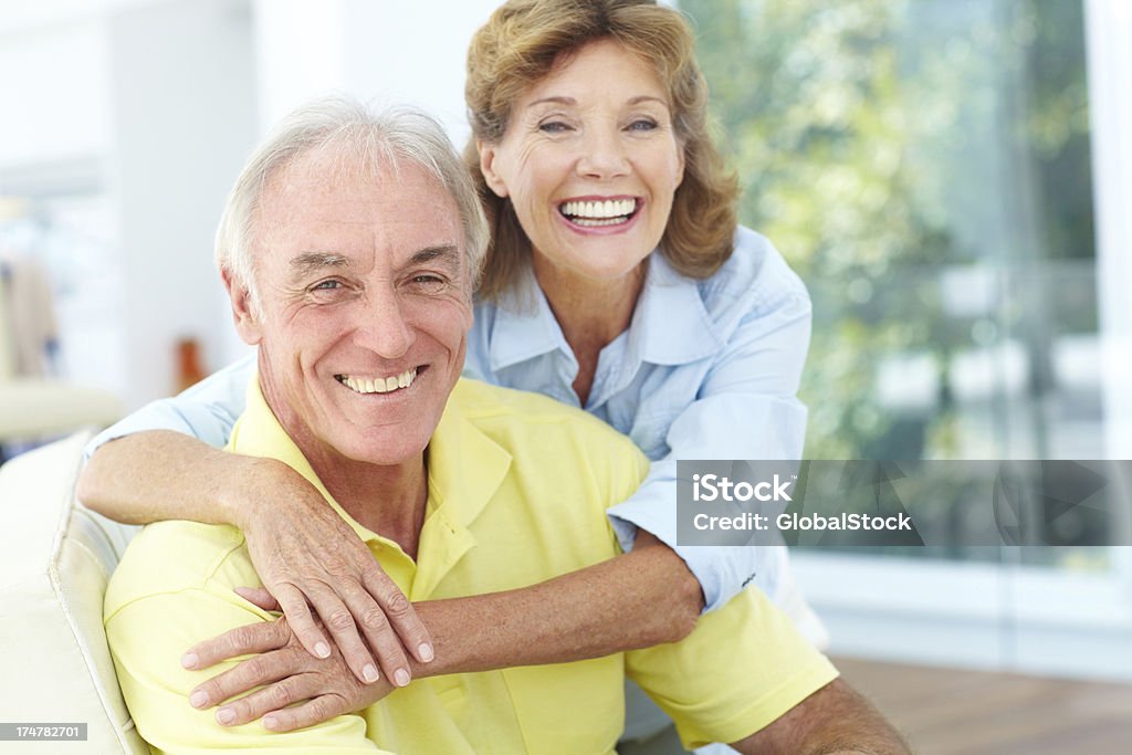 This is the time to relax and enjoy life Portrait of a loving elderly woman with her arms around her husband 60-69 Years Stock Photo