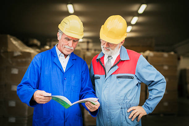 istock Two senior manual worker in front of warehouse entrance 174782780