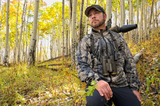 Environmental portrait of man hunting elk in Colorado Rocky Mountains.  Captured as a 14-bit Raw file. Edited in 16-bit ProPhoto RGB color space.