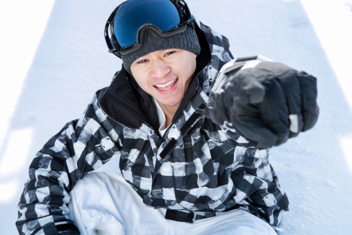 Smiling male snowboarder