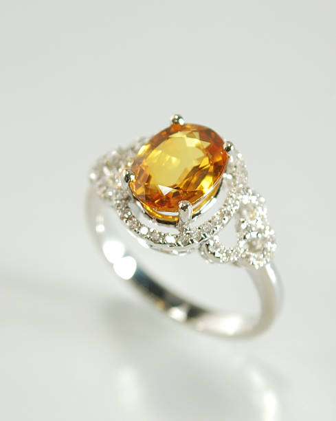 istock Woman's Diamond, Orange Sapphire and Gold Ring 174782892