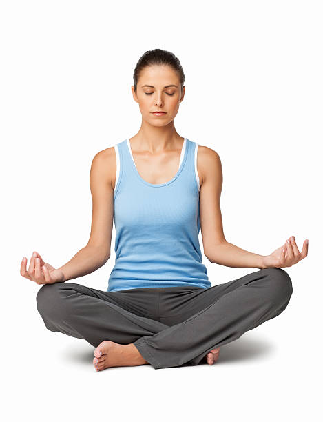 Young Caucasian woman meditating in lotus position. Vertical shot. Isolated on white.