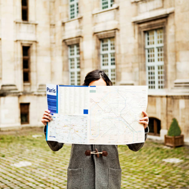 istock Woman looking at the map in Paris 174783322