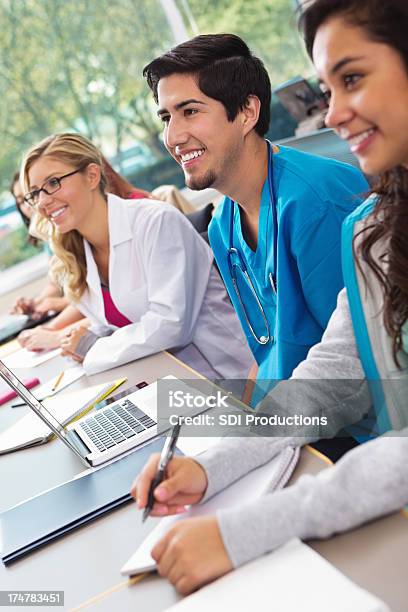 Happy Nursing Or Medical School Students Listening In College Classroom Stock Photo - Download Image Now