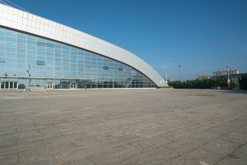 The exterior of the sports hall building and the empty square，Yantai Sports Park, Shandong, China