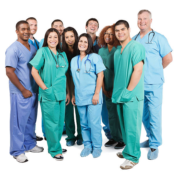 grupo diversificado de feliz hospital enfermeiras no fundo branco - nurse scrubs isolated doctor - fotografias e filmes do acervo