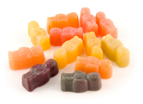 Jelly baby sweets on a white background.