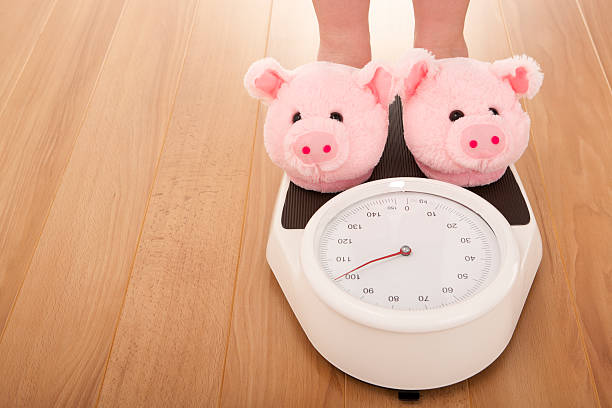 istock Pig slippers on weight scales 174785555