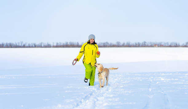 istock Smiling woman with cute dog 1747856581