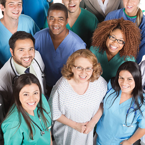istock Crowd of medical team looking up, isolated on white 174785895