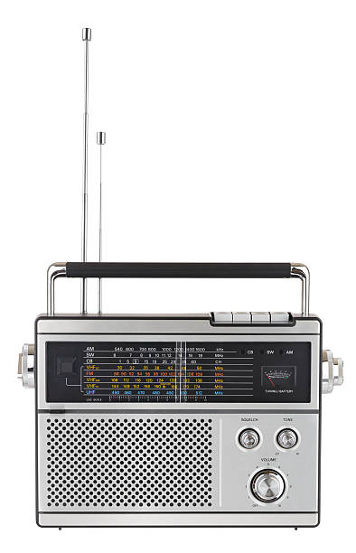 1970s Radio "An old, multi-band, portable radio from the 1970s shot in the studio and isolated on a white background." vintage portable silver radio stock pictures, royalty-free photos & images