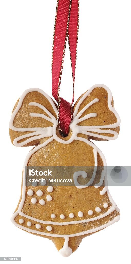 Gingerbread bell Christmas gingerbread cookie hanging on white background. Bell Stock Photo