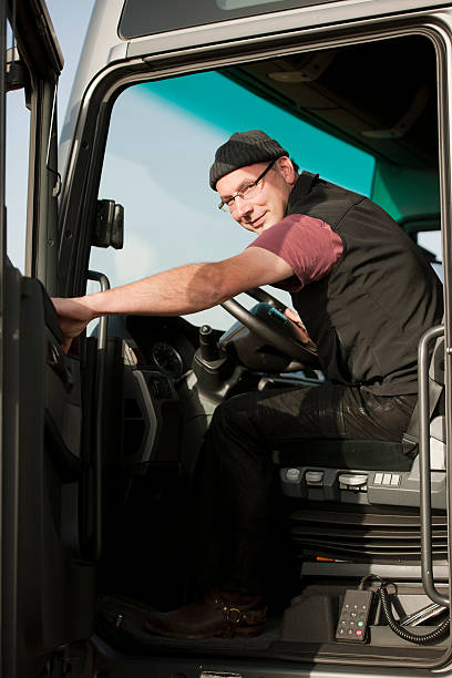 istock Truck driver closing door 174786413
