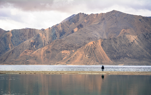 Reflection of Pangong Lake at winter in Ladakh, India. Pangong Lake also known as Pangong Tso is a beautiful endorheic lake situated in the Himalayas.