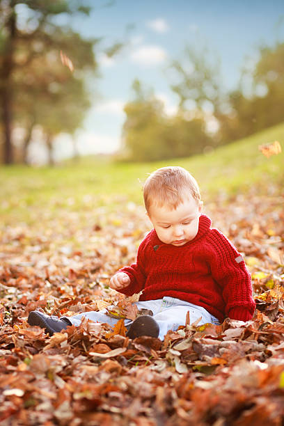 istock little baby boy playing in the nature 174786626