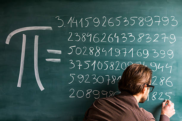 Teacher, student, scientist hand writing Pi numbers on green chalkboard stock photo